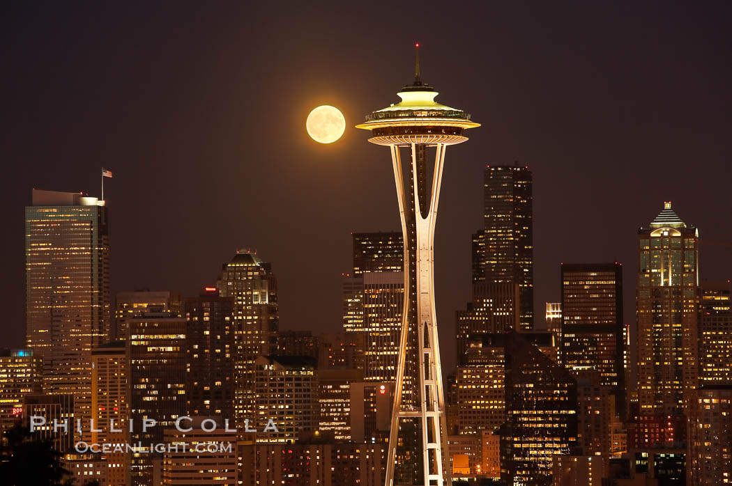 Full moon rises over Seattle city skyline, Space Needle at right. Washington, USA, natural history stock photograph, photo id 13662