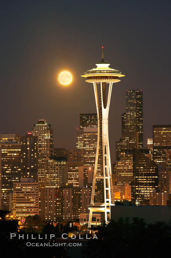 Full moon rises over Seattle city skyline, Space Needle at right. Washington, USA, natural history stock photograph, photo id 13665