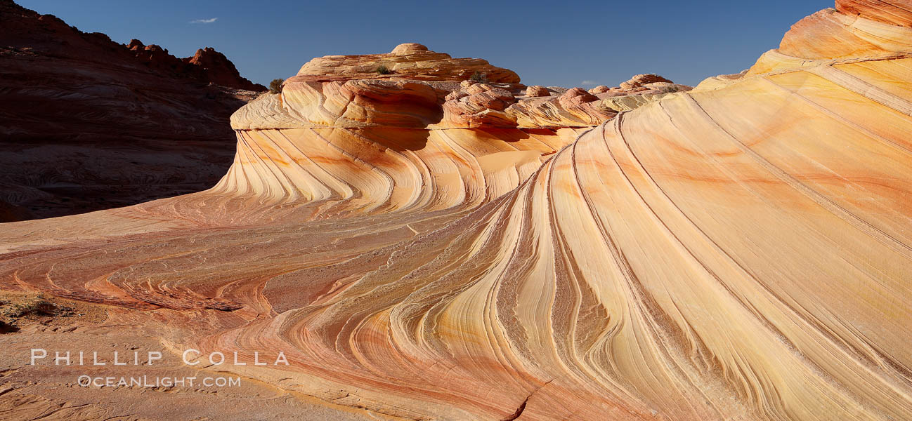 The Second Wave at sunset.  The Second Wave, a curiously-shaped sandstone swirl, takes on rich warm tones and dramatic shadowed textures at sunset.  Set in the North Coyote Buttes of Arizona and Utah, the Second Wave is characterized by striations revealing layers of sedimentary deposits, a visible historical record depicting eons of submarine geology. Paria Canyon-Vermilion Cliffs Wilderness, USA, natural history stock photograph, photo id 20624