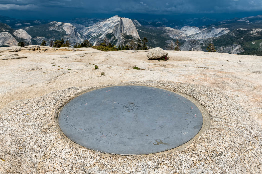 Sentinel Dome summit compass marker, with Half Dome in the distance, Yosemite National Park