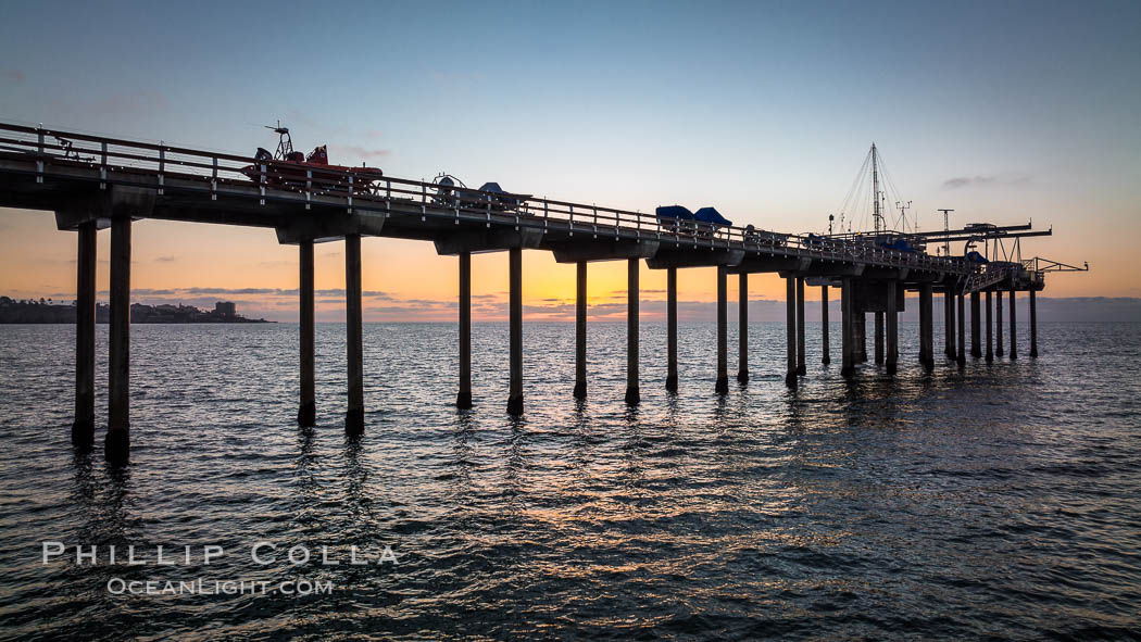 SIO Pier. The Scripps Institution of Oceanography research pier is 1090 feet long and was built of reinforced concrete in 1988, replacing the original wooden pier built in 1915. The Scripps Pier is home to a variety of sensing equipment above and below water that collects various oceanographic data. The Scripps research diving facility is located at the foot of the pier. Fresh seawater is pumped from the pier to the many tanks and facilities of SIO, including the Birch Aquarium. The Scripps Pier is named in honor of Ellen Browning Scripps, the most significant donor and benefactor of the Institution. La Jolla, California, USA, natural history stock photograph, photo id 38023