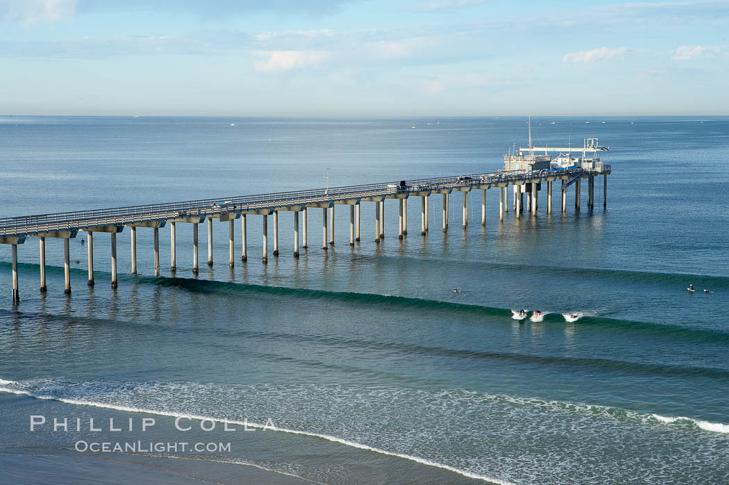 The Scripps Institution of Oceanography research pier is 1090 feet long and was built of reinforced concrete in 1988, replacing the original wooden pier built in 1915.  The Scripps Pier is home to a variety of sensing equipment above and below water that collects various oceanographic data.  The Scripps research diving facility is located at the foot of the pier.  Fresh seawater is pumped from the pier to the many tanks and facilities of SIO, including the Birch Aquarium.  The Scripps Pier is named in honor of Ellen Browning Scripps, the most significant donor and benefactor of the Institution. La Jolla, California, USA, natural history stock photograph, photo id 14748