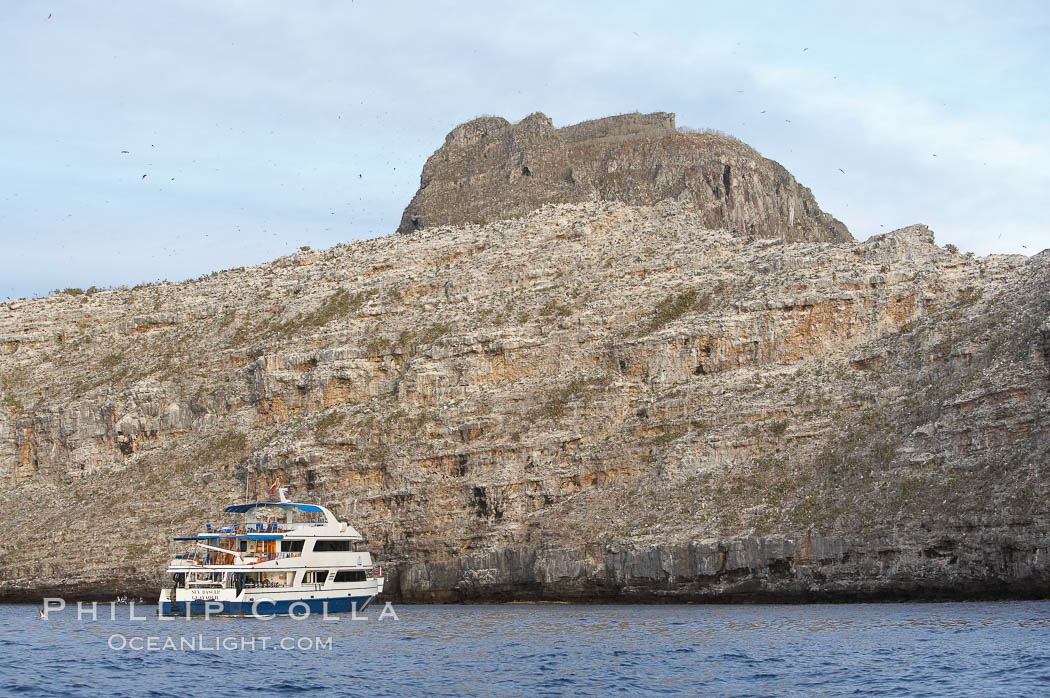 Sky Dancer, a liveaboard dive tour boat, at anchor. Wolf Island, Galapagos Islands, Ecuador, natural history stock photograph, photo id 16692