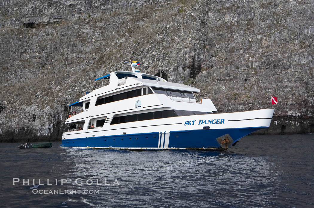 Sky Dancer, a liveaboard dive tour boat, at anchor. Wolf Island, Galapagos Islands, Ecuador, natural history stock photograph, photo id 16696