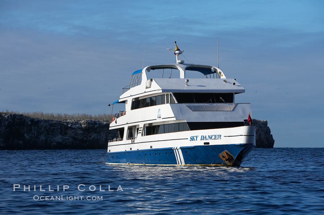 Sky Dancer, a liveaboard dive tour boat, at anchor. Wolf Island, Galapagos Islands, Ecuador, natural history stock photograph, photo id 16697