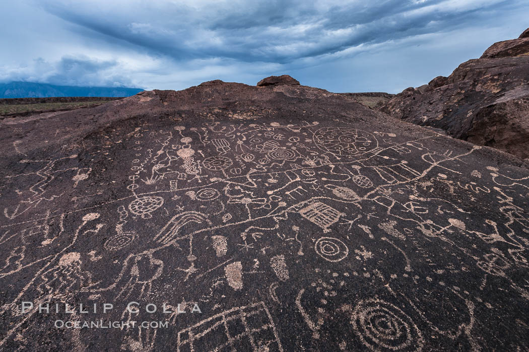 Sky Rock petroglyphs near Bishop, California.  Hidden atop an enormous boulder in the Volcanic Tablelands lies Sky Rock, a set of petroglyphs that face the sky.  These superb examples of native American petroglyph artwork are thought to be Paiute in origin, but little is known about them. USA, natural history stock photograph, photo id 27000