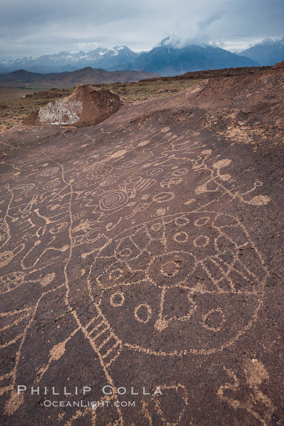 Sky Rock petroglyphs near Bishop, California.  Hidden atop on of the enormous boulders of the Volcanic Tablelands lies Sky Rock, a set of petroglyphs that face the sky.  These superb examples of native American petroglyph artwork are thought to be Paiute in origin, but little is known about them. USA, natural history stock photograph, photo id 26999