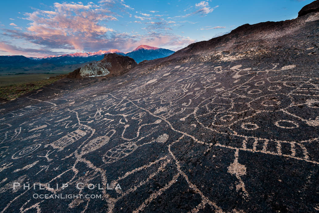Sky Rock petroglyphs near Bishop, California.  Hidden atop an enormous boulder in the Volcanic Tablelands lies Sky Rock, a set of petroglyphs that face the sky.  These superb examples of native American petroglyph artwork are thought to be Paiute in origin, but little is known about them. USA, natural history stock photograph, photo id 27007