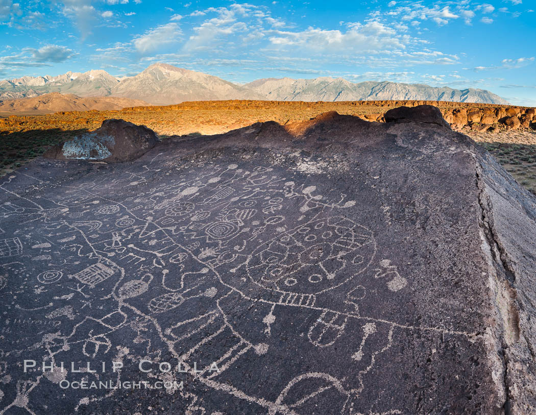 Sky Rock petroglyphs near Bishop, California.  Hidden atop on of the enormous boulders of the Volcanic Tablelands lies Sky Rock, a set of petroglyphs that face the sky.  These superb examples of native American petroglyph artwork are thought to be Paiute in origin, but little is known about them. USA, natural history stock photograph, photo id 26973