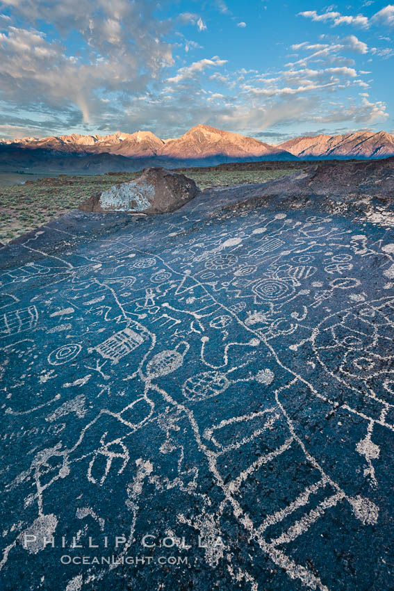 Sky Rock petroglyphs near Bishop, California.  Hidden atop on of the enormous boulders of the Volcanic Tablelands lies Sky Rock, a set of petroglyphs that face the sky.  These superb examples of native American petroglyph artwork are thought to be Paiute in origin, but little is known about them. USA, natural history stock photograph, photo id 27009
