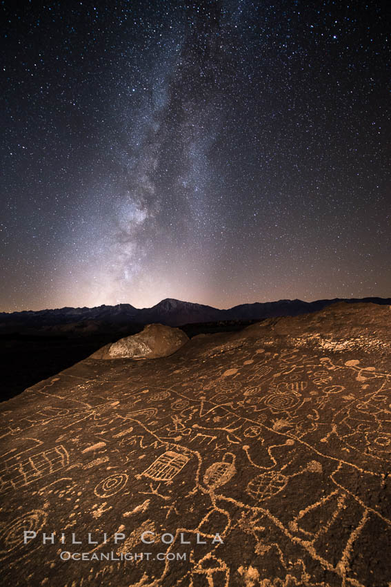 The Milky Way at Night over Sky Rock.  Sky Rock petroglyphs near Bishop, California. Hidden atop an enormous boulder in the Volcanic Tablelands lies Sky Rock, a set of petroglyphs that face the sky. These superb examples of native American petroglyph artwork are thought to be Paiute in origin, but little is known about them. USA, natural history stock photograph, photo id 28798