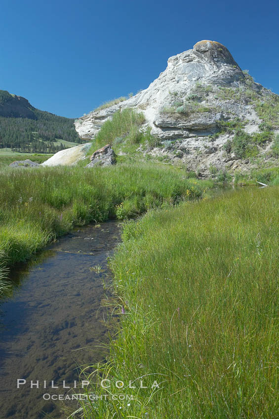 Soda Butte. This travertine (calcium carbonate) mound was formed more than a century ago by a hot spring. Only small amounts of hydrothermal water and hydrogen sulfide gas currently flow from this once more prolific spring. Yellowstone National Park, Wyoming, USA, natural history stock photograph, photo id 13645