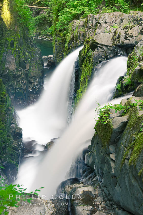 Sol Duc Falls. Sol Duc Falls is one of the largest and most beautiful waterfalls in Olympic National Park. Surrounding the falls is an old-growth forest of hemlocks and douglas firs, some of which are three hundred years in age. Sol Duc Springs, Washington, USA, natural history stock photograph, photo id 13752