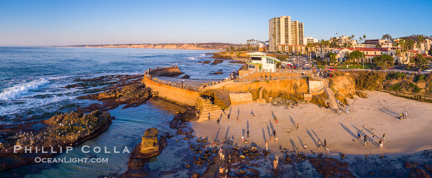 South Casa Cove and Childrens Pool sea wall, with tourist crowds at sunset on a low tide, La Jolla. California, USA, natural history stock photograph, photo id 38188