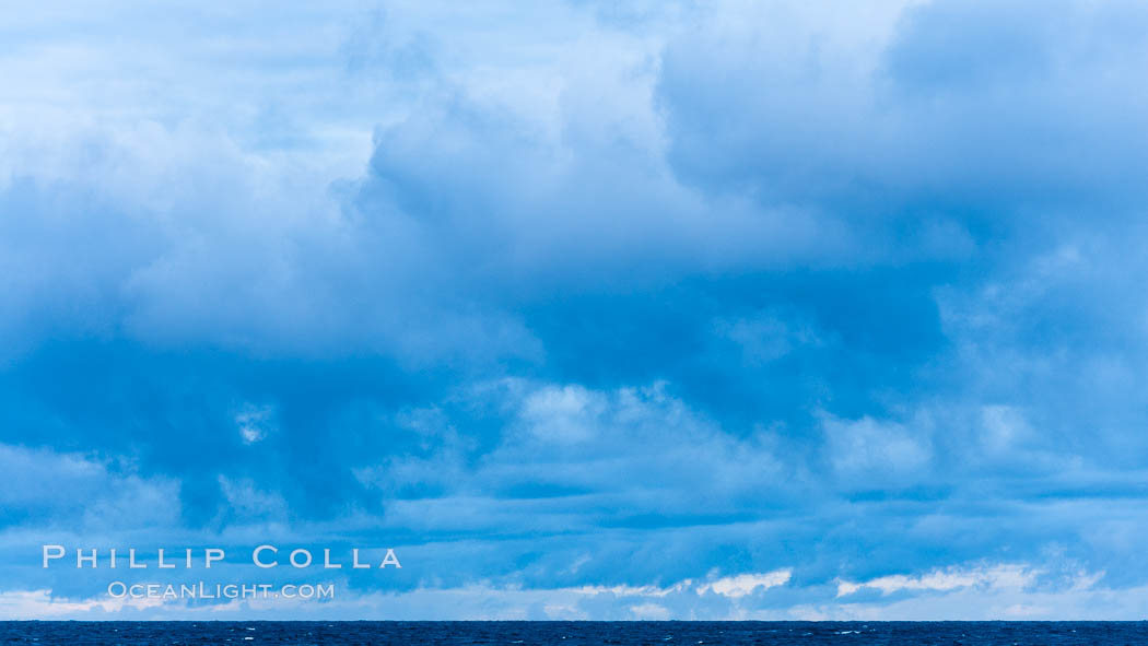 Clouds, weather and light mix in neverending forms over the open ocean of Scotia Sea, in the Southern Ocean., natural history stock photograph, photo id 24763