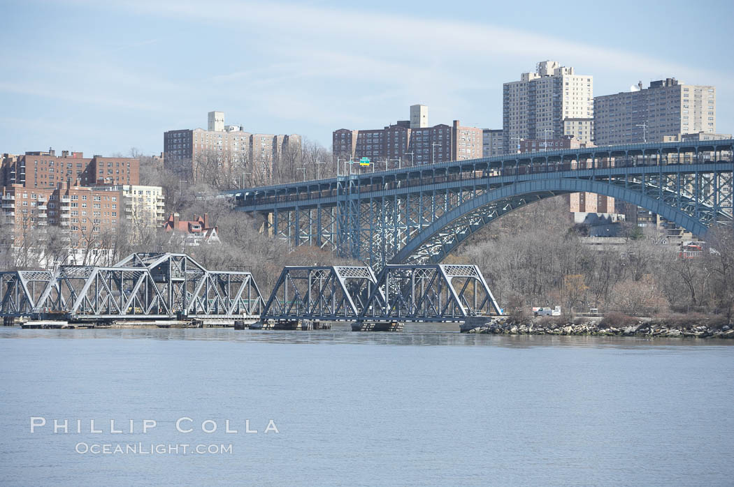 Spuyten Duyvil Swing Bridge (foreground) and Henry Hudson Bridge (background).  The Spuyten Duyvil Bridge is a swing bridge that carries Amtrak's Empire Corridor line across the Spuyten Duyvil Creek between Manhattan and the Bronx, in New York City. The bridge is located at the point where Spuyten Duyvil Creek and the Hudson River meet. USA, natural history stock photograph, photo id 11150