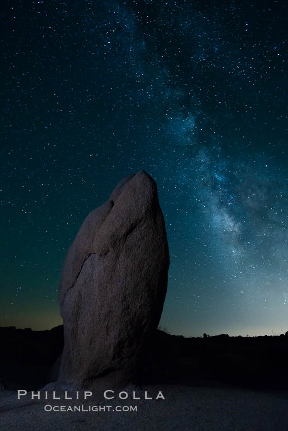 Standing stone and Milky Way, stars fill the night sky. Joshua Tree National Park, California, USA, natural history stock photograph, photo id 27815