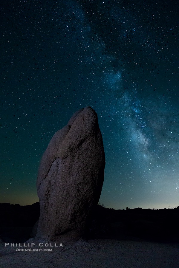 Standing stone and Milky Way, stars fill the night sky., natural history stock photograph, photo id 27815