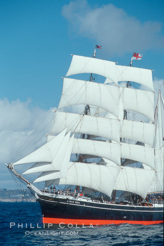 The Star of India under full sail offshore of San Diego. The Star of India is the worlds oldest seafaring ship.  Built in 1863, she is an experimental design of iron rather than wood.  She is now a maritime museum docked in San Diego Harbor, and occasionally puts to sea for special sailing events., natural history stock photograph, photo id 07786