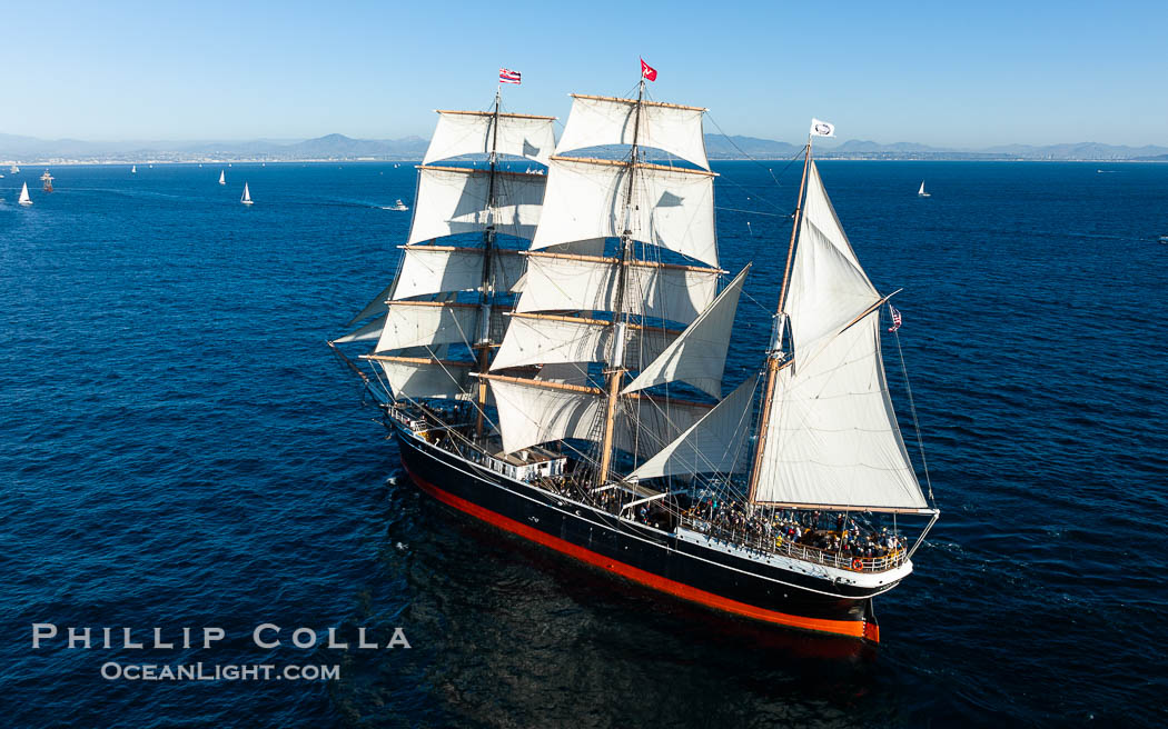 Star of Indian Aerial Photo Under Full Sail Off the Coast of San Diego. The Star of India is a 277' iron-hulled sailing ship built in 1863, and now permanently located in San Diego. It rarely leaves the dock and is seen here under a full compliment of sails off the coast of San Diego, with Tijuana Mexico seen in the distance. California, USA, natural history stock photograph, photo id 39992