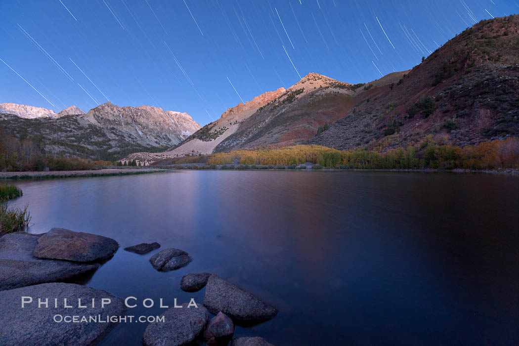 Star trails and alpenglow on the Sierra Nevada, Paiute Peak, before sunrise, reflected in North Lake in the Sierra Nevada. Bishop Creek Canyon Sierra Nevada Mountains, California, USA, natural history stock photograph, photo id 26053