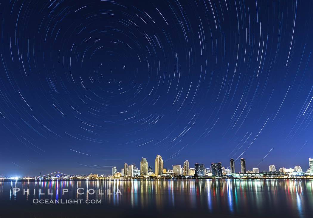 Star Trails over the San Diego Downtown City Skyline.  In this 60 minute exposure, stars create trails through the night sky over downtown San Diego., natural history stock photograph, photo id 28384