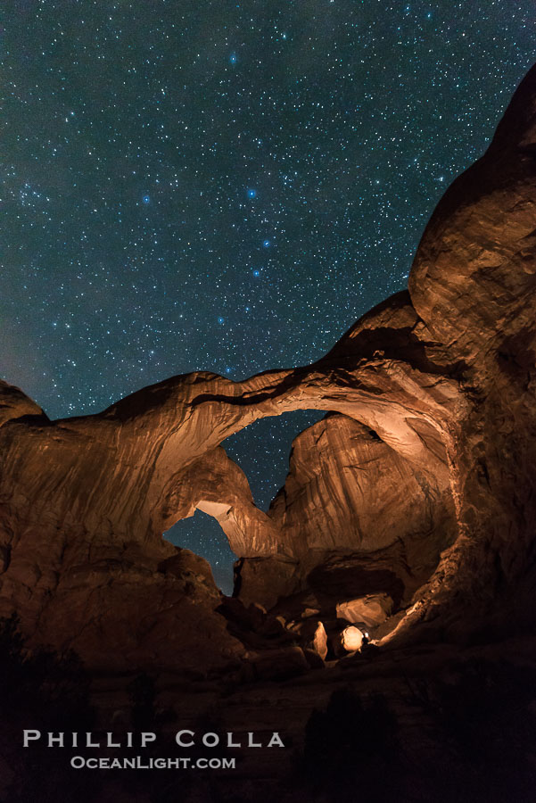 Stars over Double Arch, Arches National Park (Note: this image was created before a ban on light-painting in Arches National Park was put into effect.  Light-painting is no longer permitted in Arches National Park)., natural history stock photograph, photo id 29251