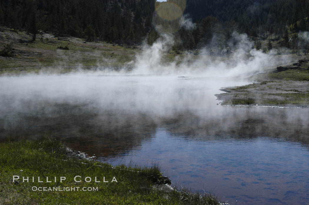 Steam rises from Firehole Lake. Lower Geyser Basin, Yellowstone National Park, Wyoming, USA, natural history stock photograph, photo id 07248