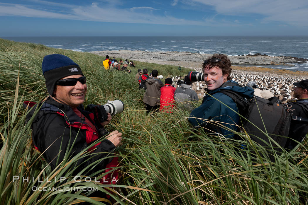 Doug Cheeseman (left), founder of Cheeseman's Ecology Safaris, and professional photographer and guide Patrick Endres (right) enjoy the spectacle of the enormous breeding colony of black-browed albatrosses at Steeple Jason Island. Falkland Islands, United Kingdom, Thalassarche melanophrys, natural history stock photograph, photo id 24108