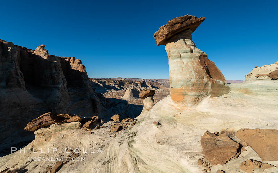 Pedestal rock, or hoodoo, at Stud Horse Point. These hoodoos form when erosion occurs around but not underneath a more resistant caprock that sits atop of the hoodoo spire. Stud Horse Point is a spectacular viewpoint on a mesa overlooking the Arizona / Utah border. Page, USA, natural history stock photograph, photo id 37776