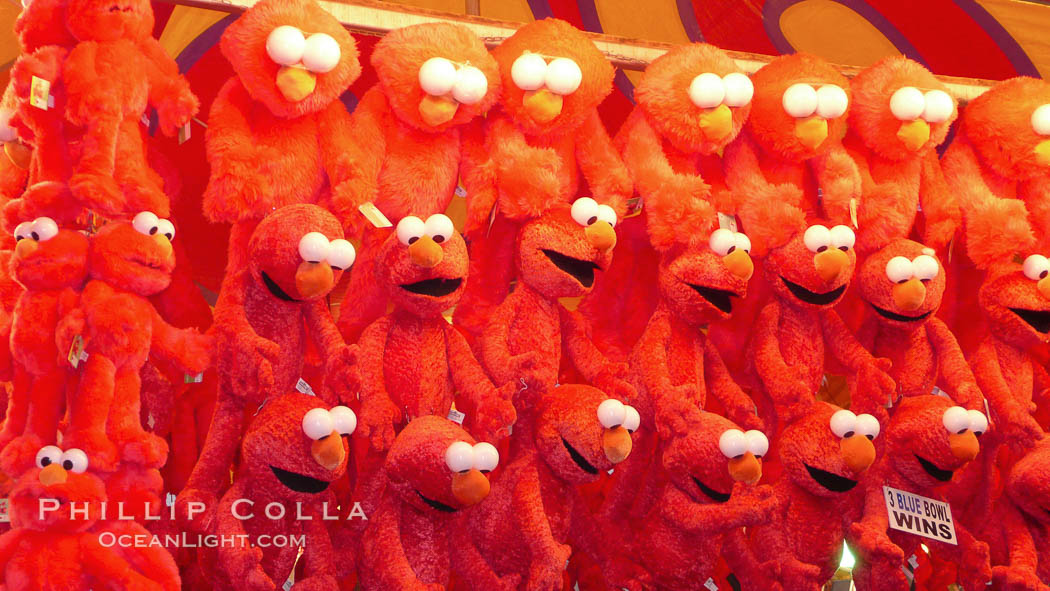 Stuffed toys hanging, waiting for fair game winners to claim them. Del Mar Fair, California, USA, natural history stock photograph, photo id 20870