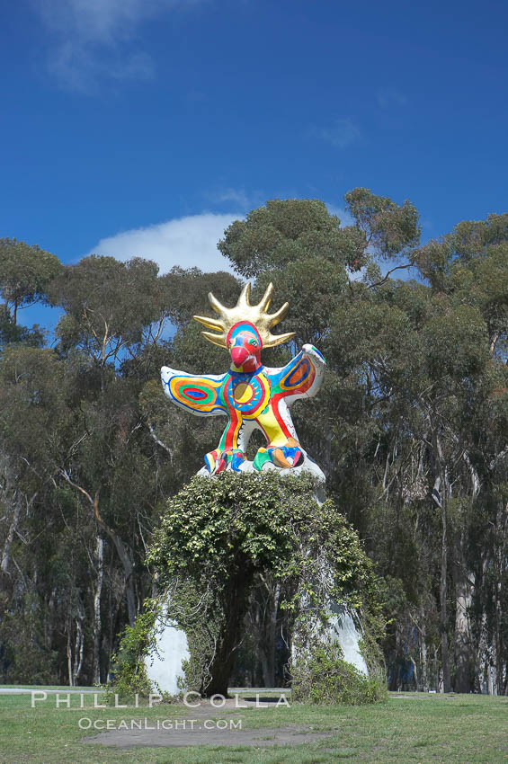 Image 12839, Sun God is a strange artwork, the first in the Stuart Collection at University of California San Diego (UCSD).  Commissioned in 1983 and produced by Niki de Sainte Phalle, Sun God has become a landmark on the UCSD campus. University of California, San Diego, La Jolla, USA, Phillip Colla, all rights reserved worldwide. Keywords: architecture, art, california, campus, college, design, education, figure, la jolla, outdoors, outside, research, san diego, scene, school, statue, stuart collection, sun god, tourism, travel, ucsd, university, university of california, university of california san diego, usa.