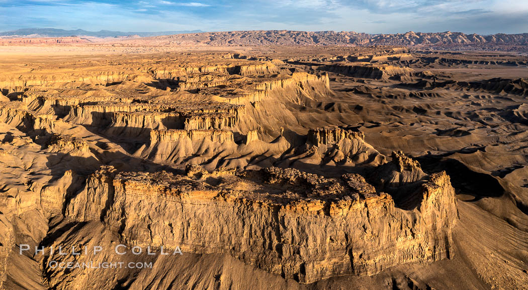 Sunrise over the Skyline Rim, Factory Bench and Lower Blue Hills, Utah. The San Rafael Swell is in the distance. USA, natural history stock photograph, photo id 38026