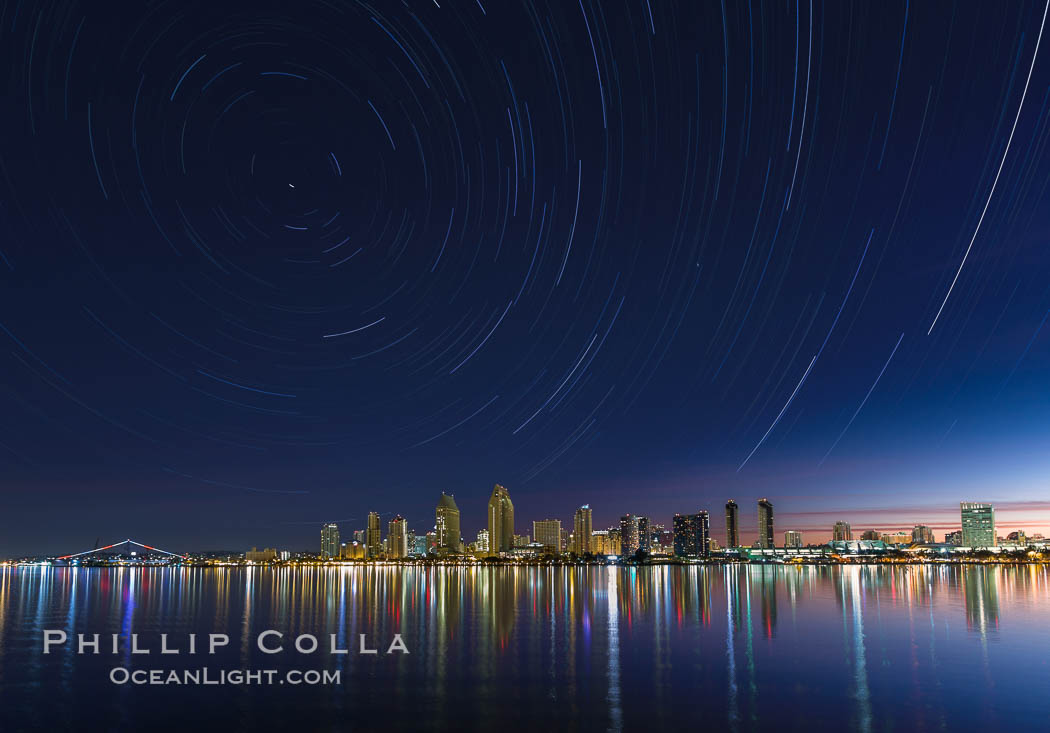 Approaching sunrise and star trails over the San Diego Downtown City Skyline.  In this 60 minute exposure, stars create trails through the night sky over downtown San Diego. California, USA, natural history stock photograph, photo id 28387