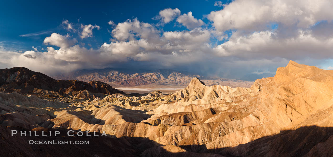 Sunrise at Zabriskie Point, Manly Beacon is lit by the morning sun while clouds from a clearing storm pass by. Death Valley National Park, California, USA, natural history stock photograph, photo id 27658