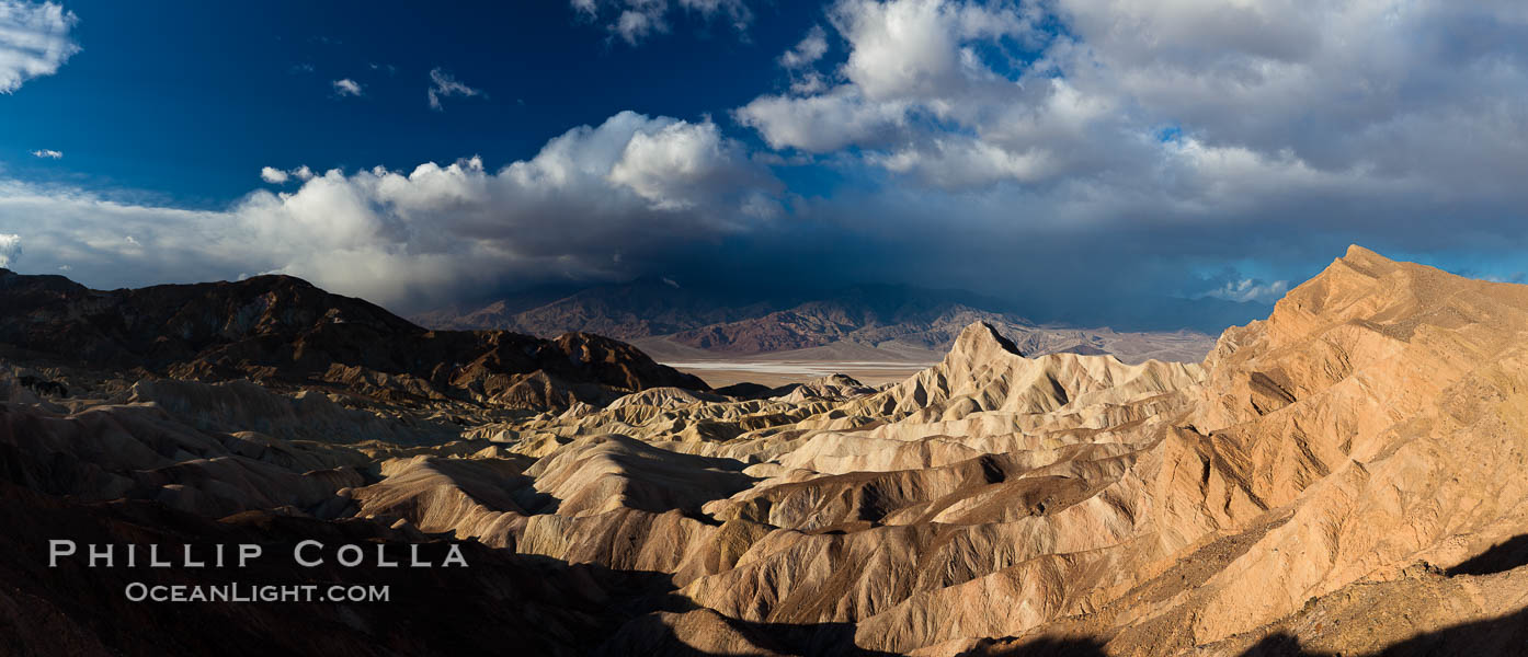 Sunrise at Zabriskie Point, Manly Beacon is lit by the morning sun while clouds from a clearing storm pass by. Death Valley National Park, California, USA, natural history stock photograph, photo id 27659