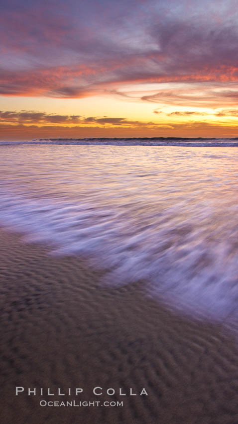 Sunset and incoming surf, gorgeous colors in the sky and on the ocean at dusk, the incoming waves are blurred in this long exposure. Carlsbad, California, USA, natural history stock photograph, photo id 27155