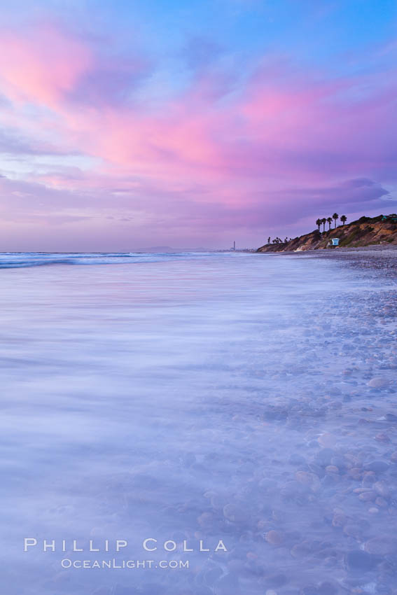 Sunset and incoming surf, gorgeous colors in the sky and on the ocean at dusk, the incoming waves are blurred in this long exposure. Carlsbad, California, USA, natural history stock photograph, photo id 27171