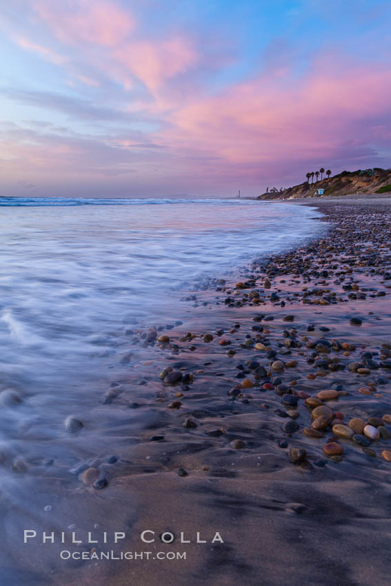 Sunset and incoming surf, gorgeous colors in the sky and on the ocean at dusk, the incoming waves are blurred in this long exposure. Carlsbad, California, USA, natural history stock photograph, photo id 27165