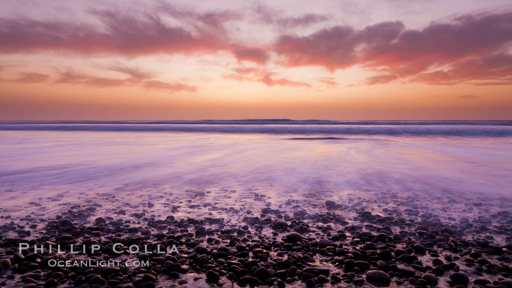 Sunset and incoming surf, gorgeous colors in the sky and on the ocean at dusk, the incoming waves are blurred in this long exposure., natural history stock photograph, photo id 27169