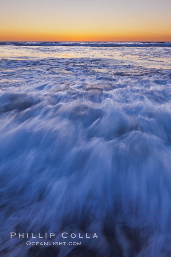 Sunset and incoming surf, gorgeous colors in the sky and on the ocean at dusk, the incoming waves are blurred in this long exposure. Carlsbad, California, USA, natural history stock photograph, photo id 27189