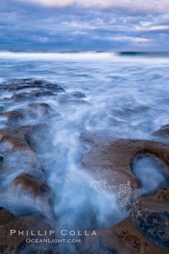 Waves wash over sandstone reef, clouds and sky. La Jolla, California, USA, natural history stock photograph, photo id 26335