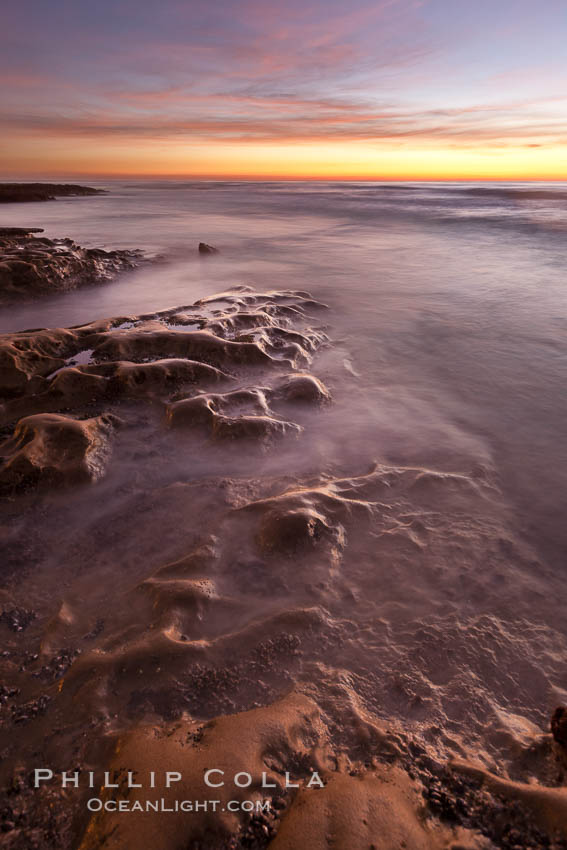 Waves wash over sandstone reef, clouds and sky. La Jolla, California, USA, natural history stock photograph, photo id 26455