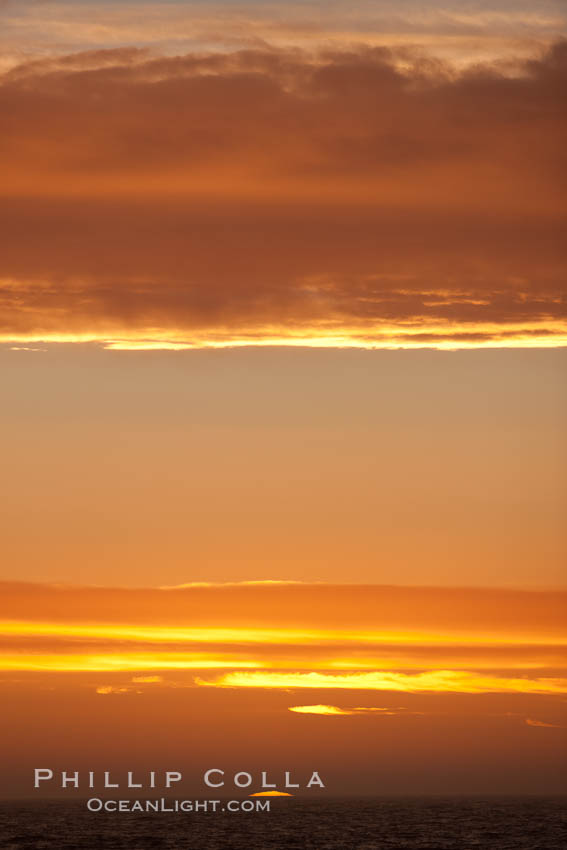Sunset, dusk clouds, detail in the sky over the open sea, somewhere between Falkland Islands and South Georgia Island. Southern Ocean, natural history stock photograph, photo id 24136