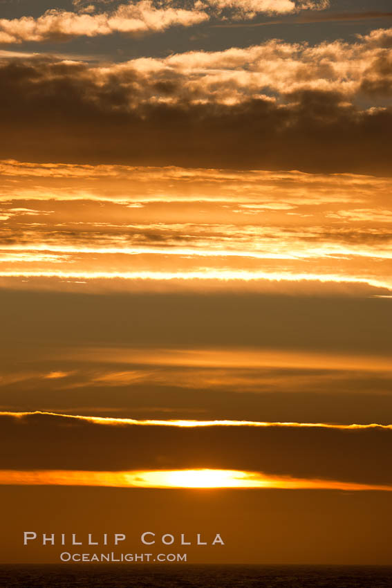 Sunset, dusk clouds, detail in the sky over the open sea, somewhere between Falkland Islands and South Georgia Island. Southern Ocean, natural history stock photograph, photo id 24185