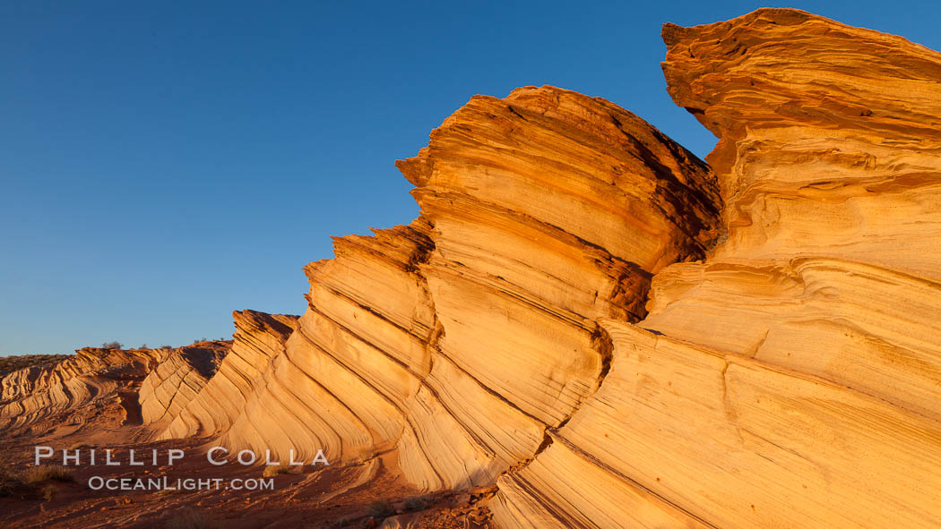 The Great Wall, Navajo Tribal Lands, Arizona. Sandstone "fins", eroded striations that depict how sandstone -- ancient compressed sand -- was laid down in layers over time.  Now exposed, the layer erode at different rates, forming delicate "fins" that stretch for long distances. Page, USA, natural history stock photograph, photo id 26614