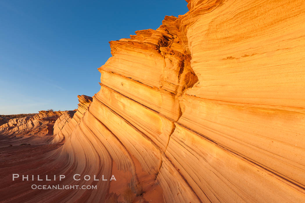 Sandstone "fins", eroded striations that depict how sandstone -- ancient compressed sand -- was laid down in layers over time.  Now exposed, the layer erode at different rates, forming delicate "fins" that stretch for long distances. Navajo Tribal Lands, Page, Arizona, USA, natural history stock photograph, photo id 26678
