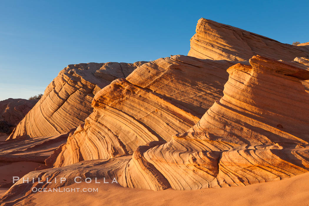 Sandstone "fins", eroded striations that depict how sandstone -- ancient compressed sand -- was laid down in layers over time.  Now exposed, the layer erode at different rates, forming delicate "fins" that stretch for long distances. Navajo Tribal Lands, Page, Arizona, USA, natural history stock photograph, photo id 26682