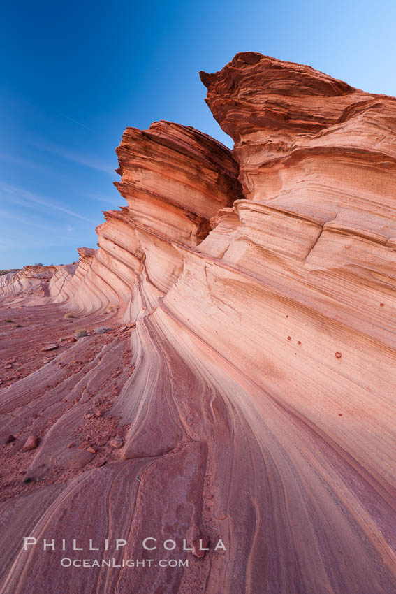 The Great Wall, Navajo Tribal Lands, Arizona. Sandstone "fins", eroded striations that depict how sandstone -- ancient compressed sand -- was laid down in layers over time.  Now exposed, the layer erode at different rates, forming delicate "fins" that stretch for long distances. Page, USA, natural history stock photograph, photo id 26643