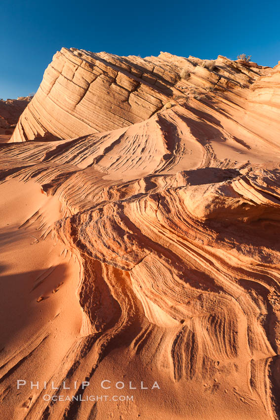 Sandstone "fins", eroded striations that depict how sandstone -- ancient compressed sand -- was laid down in layers over time.  Now exposed, the layer erode at different rates, forming delicate "fins" that stretch for long distances. Navajo Tribal Lands, Page, Arizona, USA, natural history stock photograph, photo id 26647